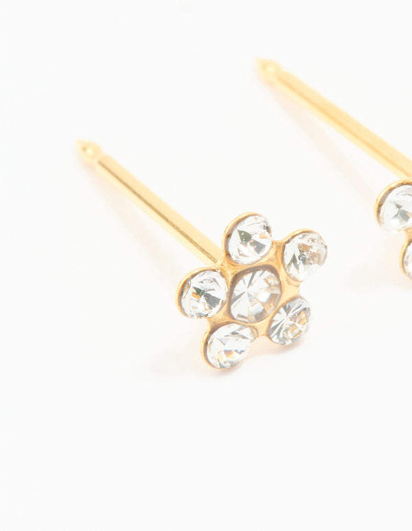 Showcasing 24K gold plated surgical stainless steel cubic zirconia daisy piercing stud with floral pattern and dainty details in clear close up view