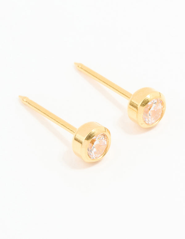 These 24K gold plated surgical stainless steel 3MM cubic zirconia bezel piercing studs feature a crystal design with stud closure front view