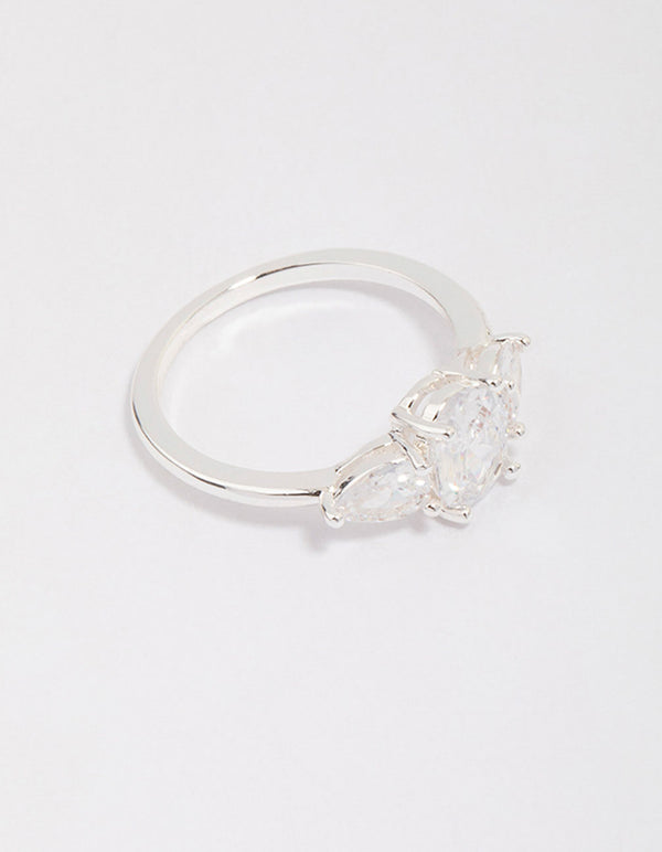 Showcasing a silver plated oval enchanting ring with stone cut design side detail view