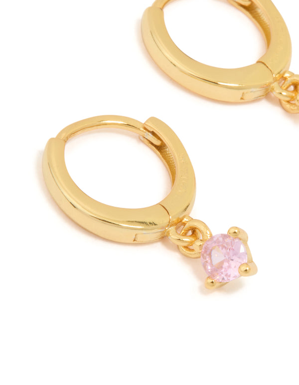 Designed with gold plated sterling silver and pink cubic zirconia hoop earrings close up view