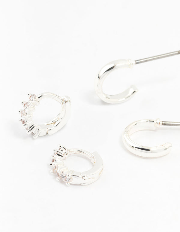 Showcasing statement silver mixed diamante huggie hoop earrings in a 3-pack close up view