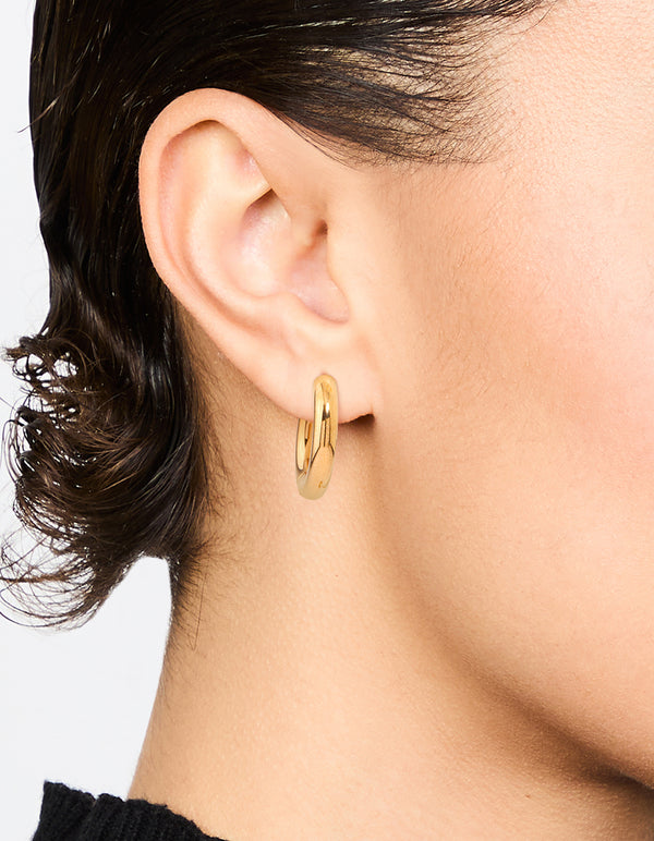 Showcasing waterproof gold plated stainless steel thick clicker hoop earrings 22 MM in statement style on ear view