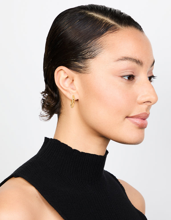 Presenting waterproof gold plated stainless steel thick clicker hoop earrings 22 MM with statement design on model view