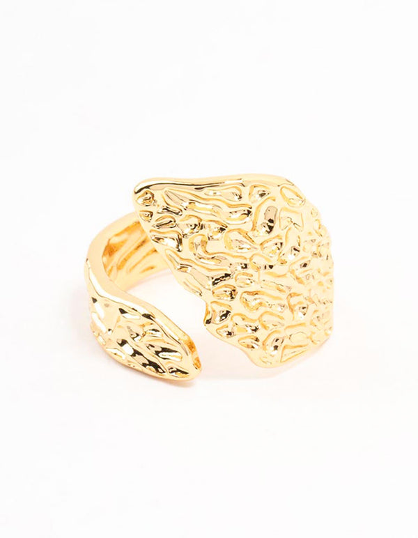Crafted from gold plated textured metal this wrap ring close up view