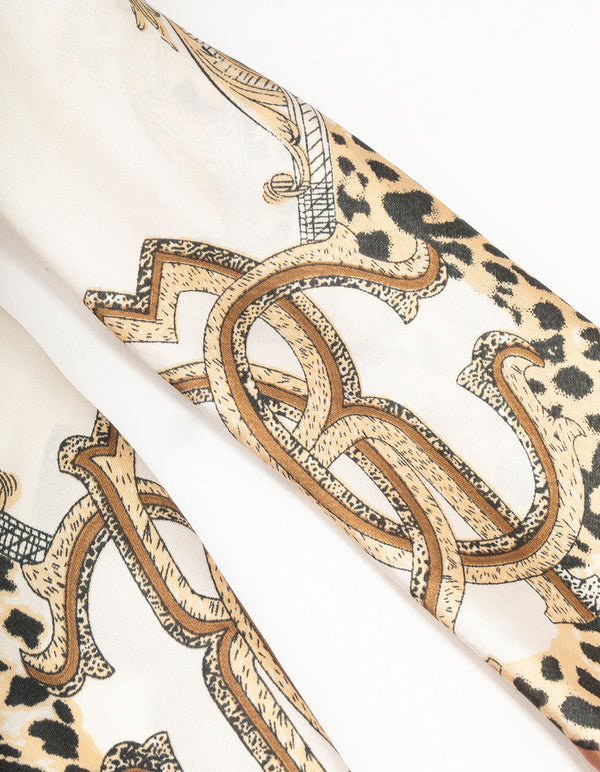Designed with leopard and chain fabric scarf featuring animal print in ivory, tan, black detail view