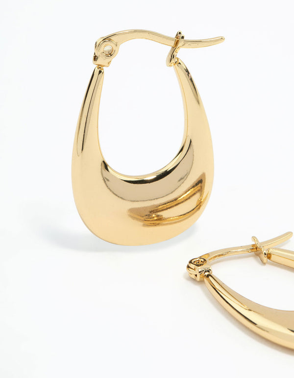 Detailed view of waterproof elongated flat hoop earrings crafted from gold plated stainless steel with secure closure close up view