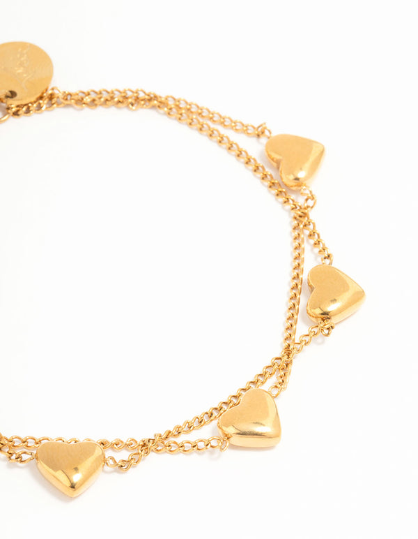 Elegant waterproof gold plated stainless steel heart charm bracelet close up view