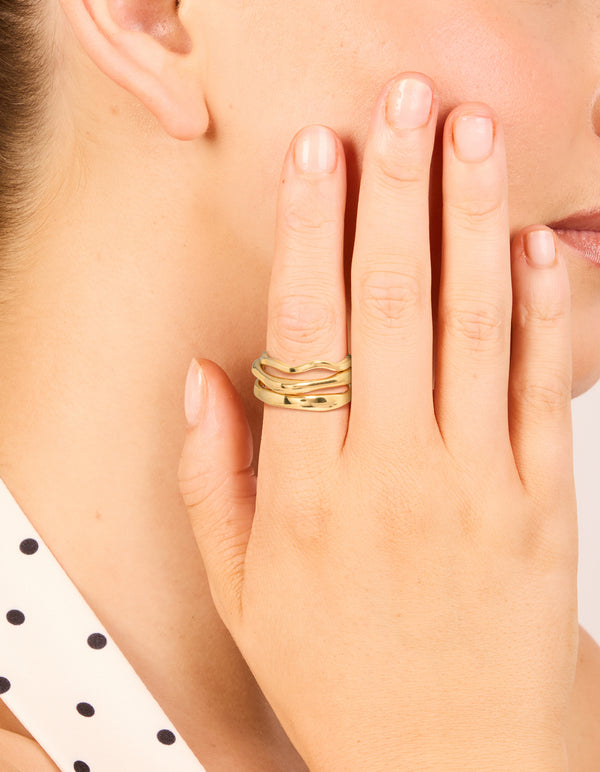 Showcasing waterproof gold plated stainless steel organic rings in a 3-pack on finger view