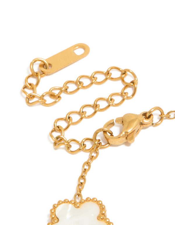This waterproof gold plated stainless steel flower petal charm bracelet with ivory accents displays secure clasp closure detail view