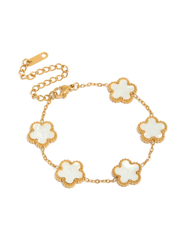 Highlighting a waterproof gold plated stainless steel bracelet featuring floral petal charm in white front view