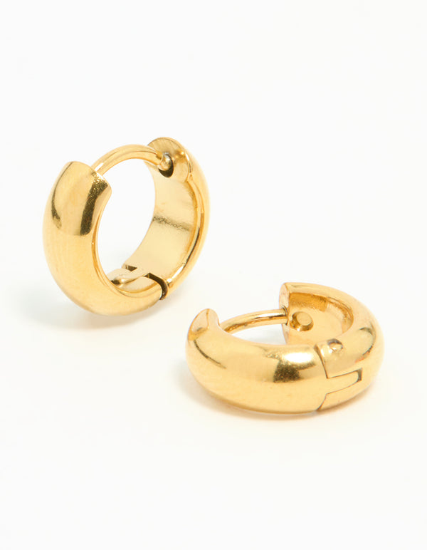 Showcasing waterproof gold plated stainless steel chubby huggie earrings with closure on ear view