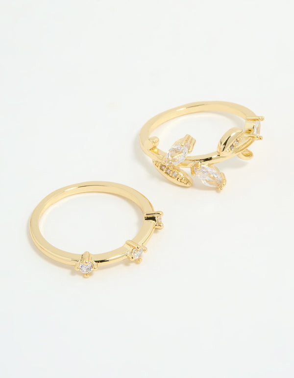 Highlighting gold plated cubic zirconia leafy station rings in a 3-pack close up view