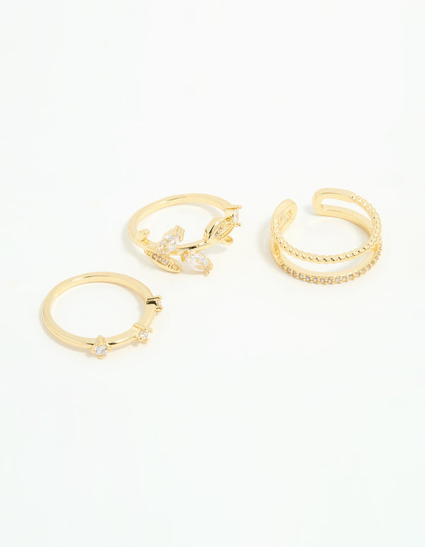 Showcasing gold plated cubic zirconia leafy station rings in a 3-pack front view