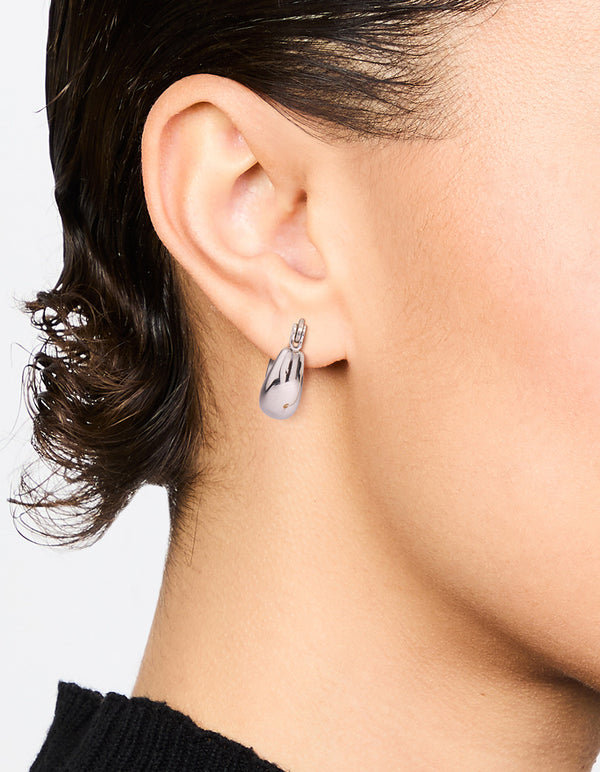 Elegant waterproof gold plated stainless steel organic twisted hoop earrings in silver on ear view