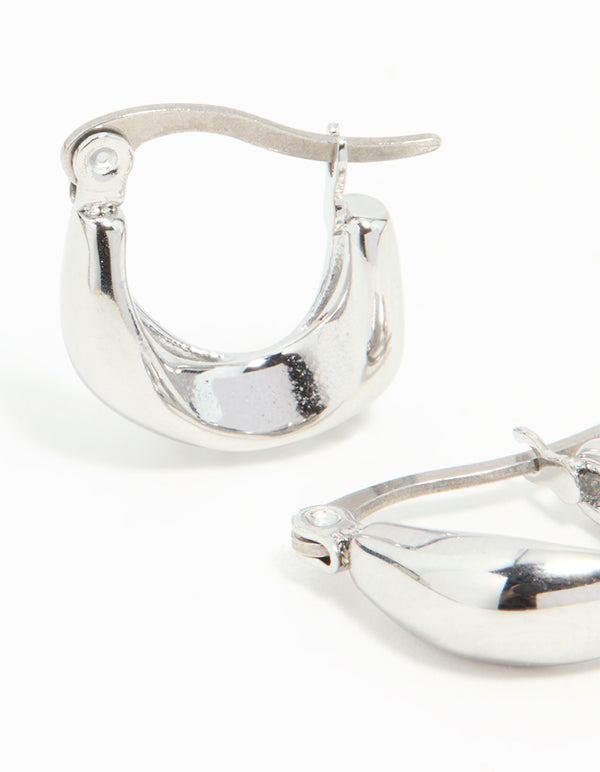 Displaying waterproof gold plated stainless steel organic twisted hoop closure mechanism close up view