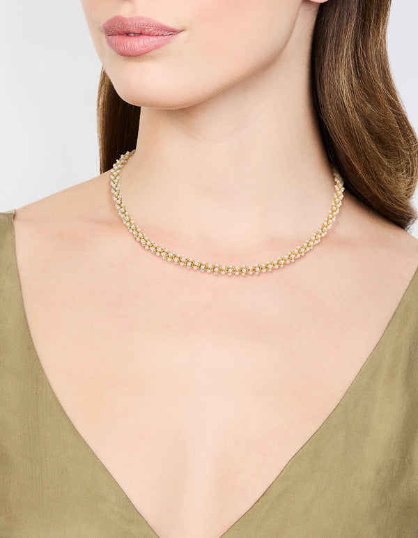 Crafted from gold plated material, this pearl fireball bracelet in white on model view