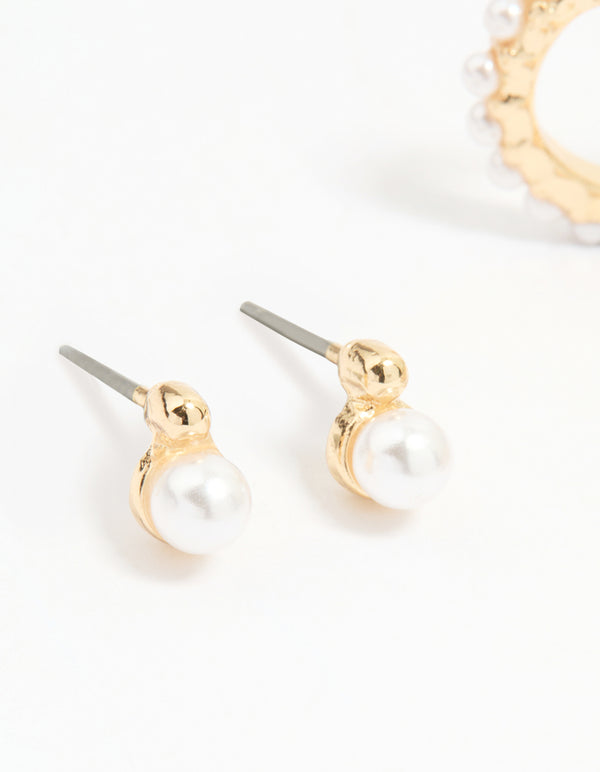 Crafted from gold with mixed pearl huggie earrings in a 3-pack close up view