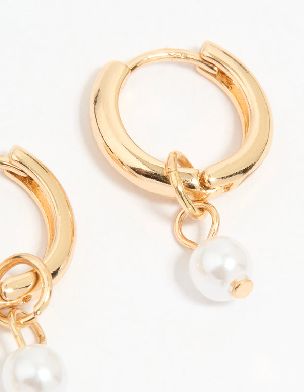 Highlighting gold mixed pearl huggie earrings in a 3-pack post detail view