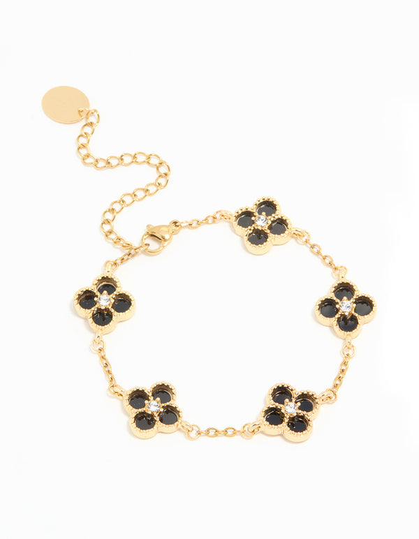 Showcasing a waterproof charm floral bracelet crafted from gold plated stainless steel with diamante black inlay flowers front view