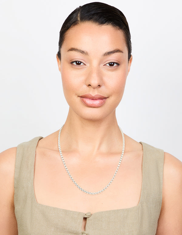 Designed with waterproof stainless steel round box chain short necklace in silver on model view