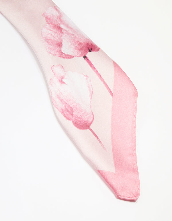 Crafted fabric scarf in light pink with flower border displaying white floral pattern detail view