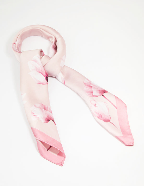 Elegant fabric scarf in light pink with flower border featuring a white floral pattern front view