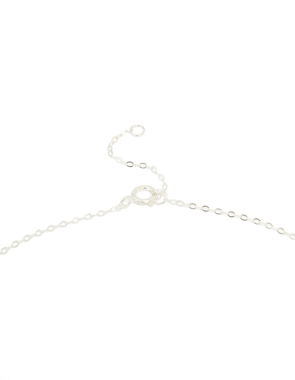 Close-up of sterling silver blue cubic zirconia and starfish pendant necklace highlighting ocean charm details with delicate crystal finish clasp detail view