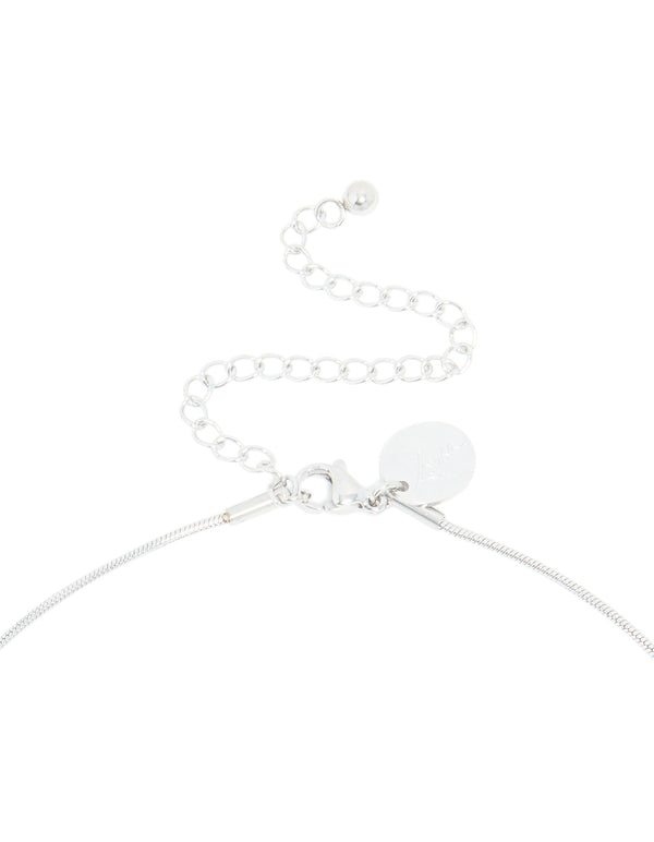 Highlighting the clasp detail of a waterproof stainless steel pull through lariat necklace in silver featuring dainty styling clasp detail view
