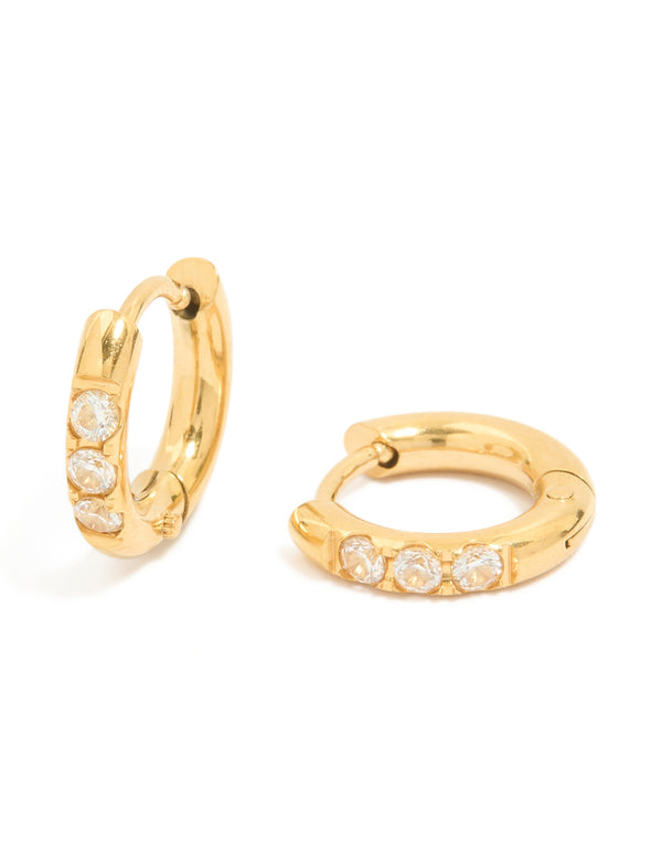 Showcasing waterproof huggie earrings featuring cubic zirconia in stainless steel with gold plated finish front view