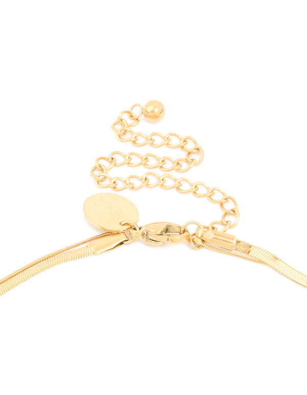 Crafted from waterproof gold plated stainless steel, this cubic zirconia and snake chain layered necklace in gold clasp detail view