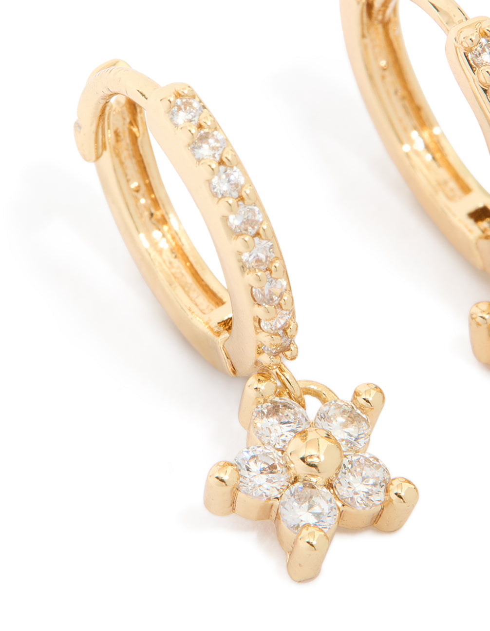 Crafted with gold plated cubic zirconia, these flower pendant huggie earrings showcase and huggie closure close up view