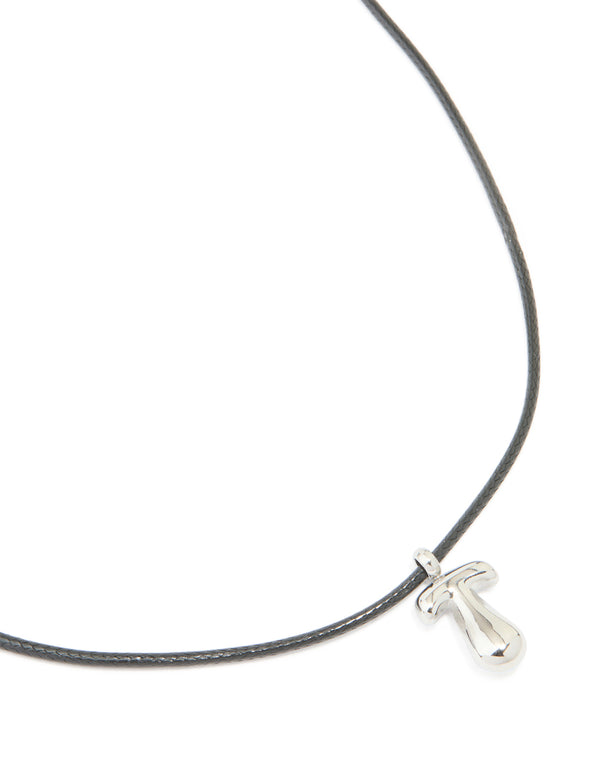 Showcasing a waterproof stainless steel large bubble letter T silver pendant on grey cord necklace close up view