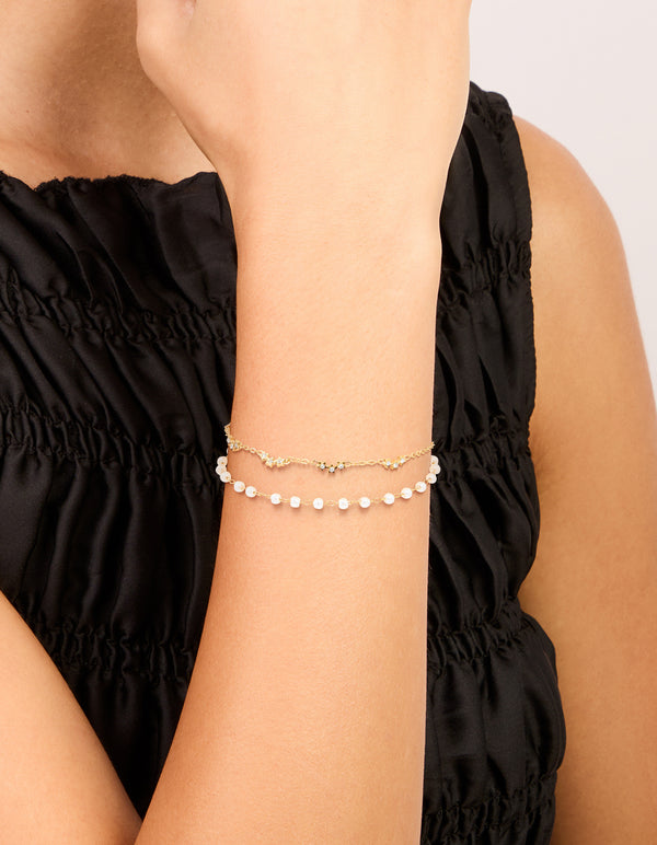 Elegant waterproof gold plated stainless steel bracelet, pearl, and cubic zirconia on wrist view