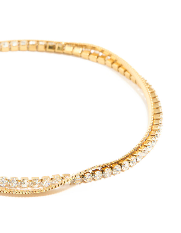A waterproof gold plated stainless steel diamante and snake chain layered bracelet close up view