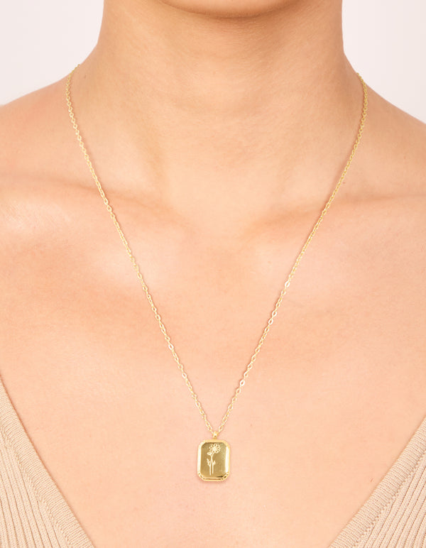 Stylish waterproof floral detail October birth flower marigold necklace crafted in gold plated stainless steel with pendant on neck view