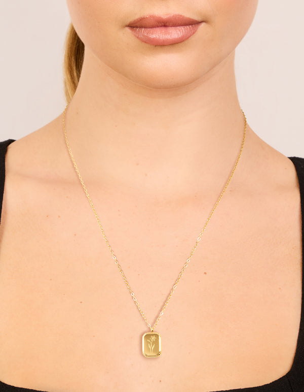 Elegantly displayed waterproof march birth flower daffodil pendant necklace in gold plated stainless steel close up view