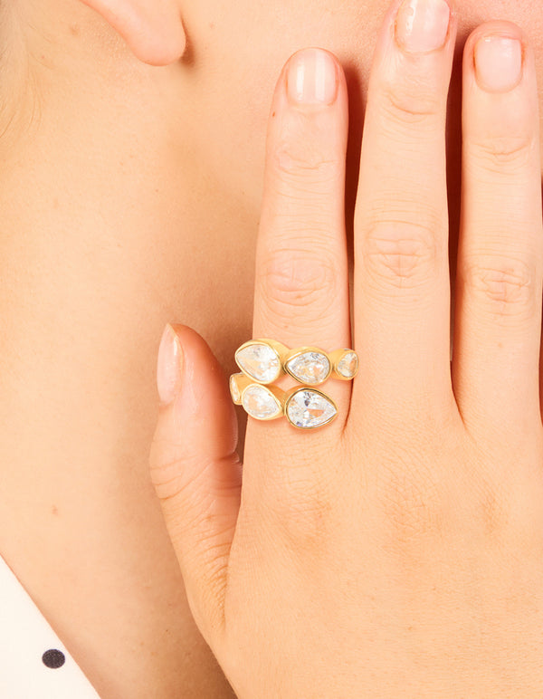 Displaying a waterproof gold plated stainless steel wrap ring with pear cut cubic zirconia in clear tone on finger view