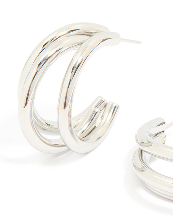 Detailed look at waterproof stainless steel triple prong hoop earrings in silver close up view