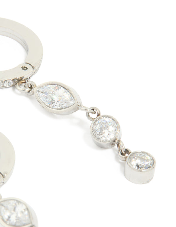 Crafted from waterproof stainless steel, these cubic zirconia huggie drop earrings in silver feature clear stone post detail view