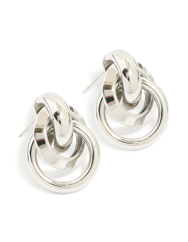 Showcasing waterproof stainless steel knotted link drop earrings in silver on ear view