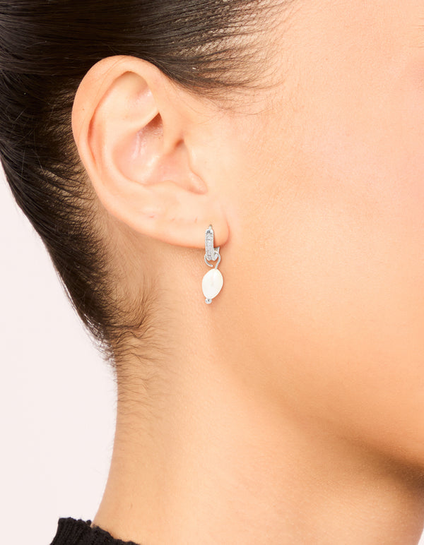 Elegant freshwater pearl drop huggie earrings featuring diamante accents in waterproof stainless steel on ear view