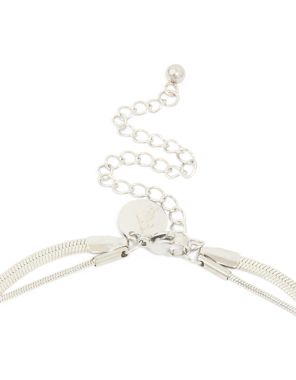 Showcasing a waterproof stainless steel chain and pebble layered necklace with pendant in silver clasp detail view
