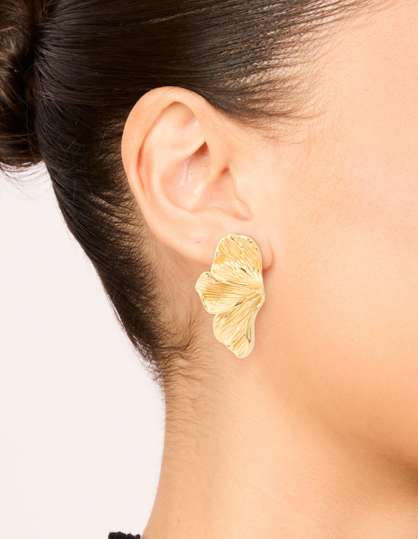 Featuring waterproof gold plated stainless steel petal fan earrings on ear view