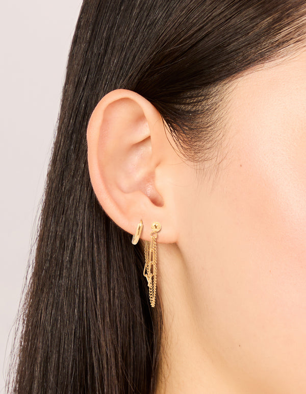 Featuring waterproof gold plated stainless steel classic chain earrings and huggie earrings in a 2-pack with stud closure on ear view