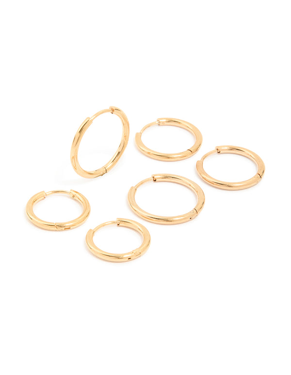 Featuring waterproof gold plated stainless steel classic huggie clicker earrings in a 3-pack front view