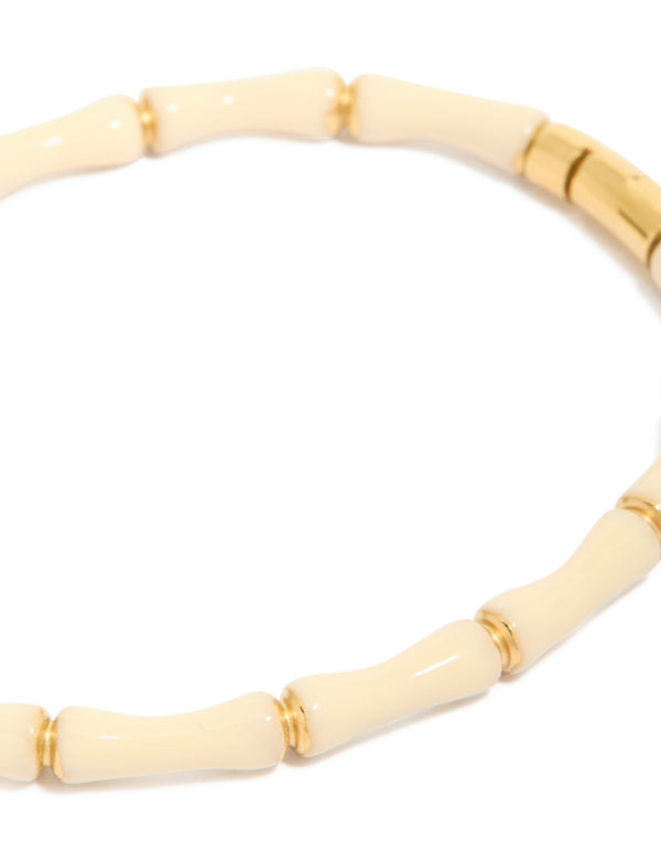 Elegant waterproof bamboo white enamel bangle crafted from gold plated stainless steel with ivory close up view
