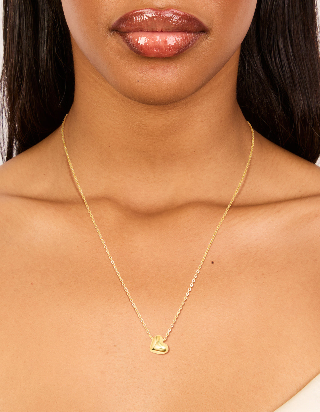 Featuring a waterproof gold plated stainless steel dainty heart pendant necklace style on neck view