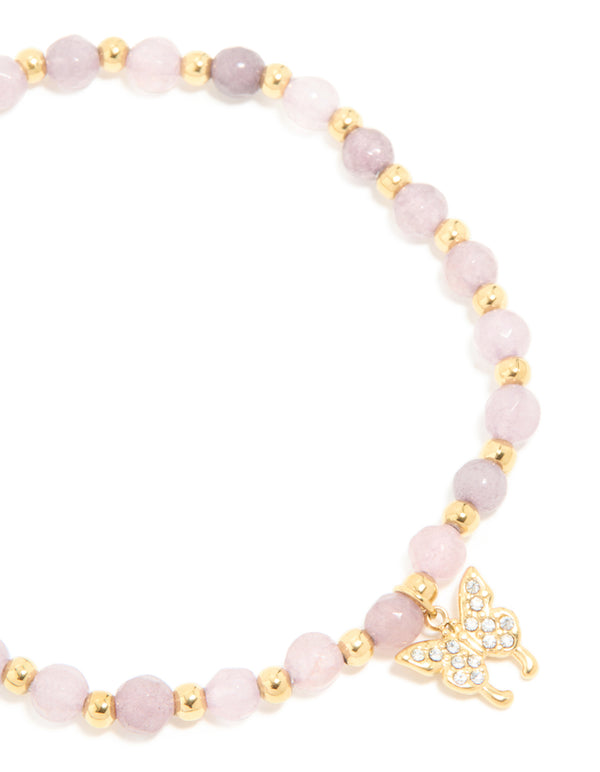Highlighting a waterproof gold plated stainless steel amethyst semi precious stone butterfly stretch bracelet with beads close up view