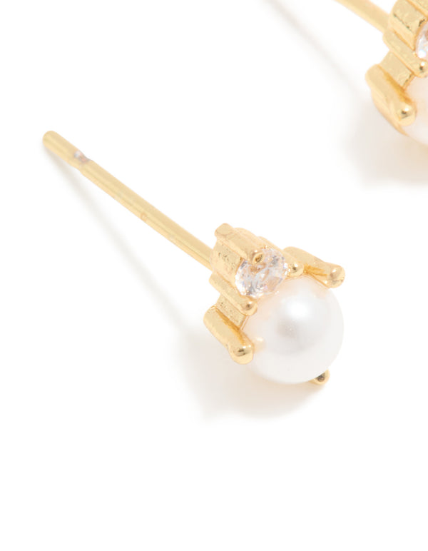 Designed with waterproof gold plated stainless steel craftsmanship, June cubic zirconia duo stud earrings featuring pearl accents close up view