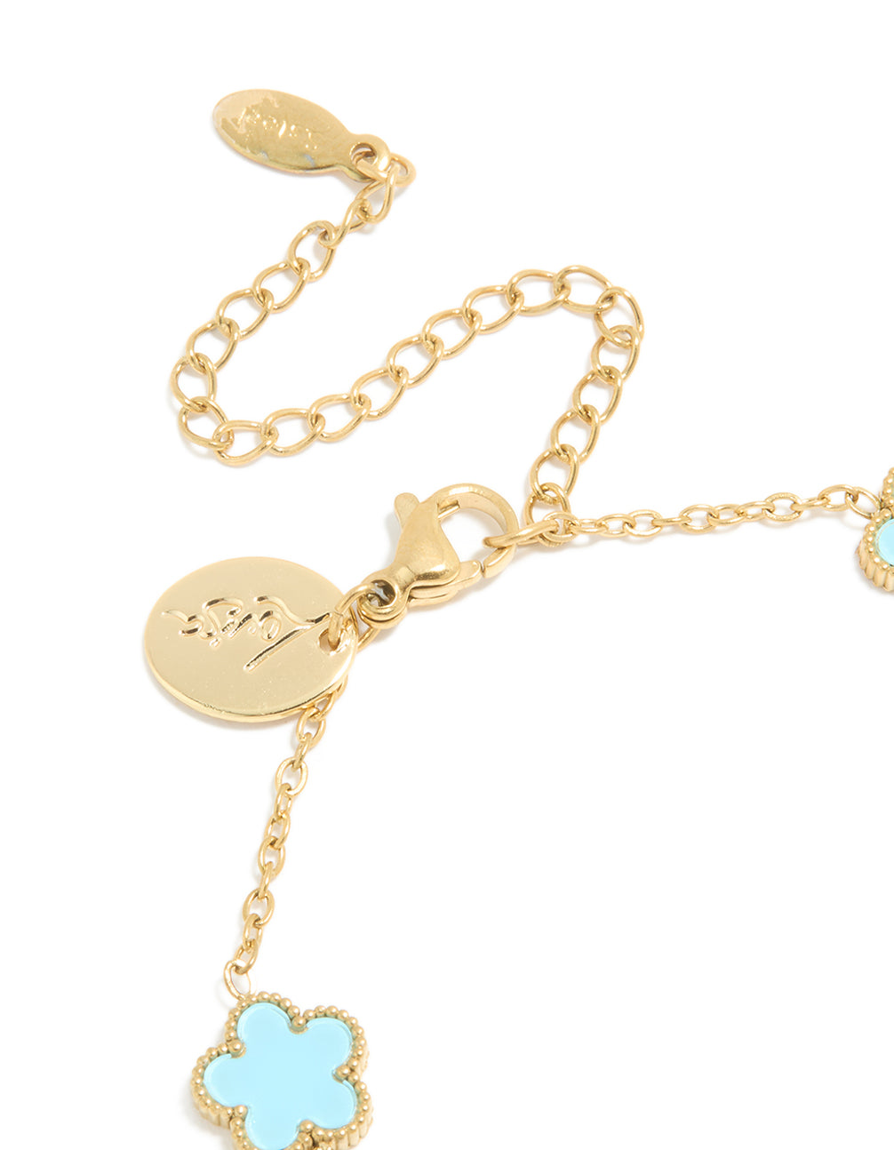 Elegantly designed waterproof gold plated stainless steel light blue petal flower charm bracelet in powder blue and gold closure detail view